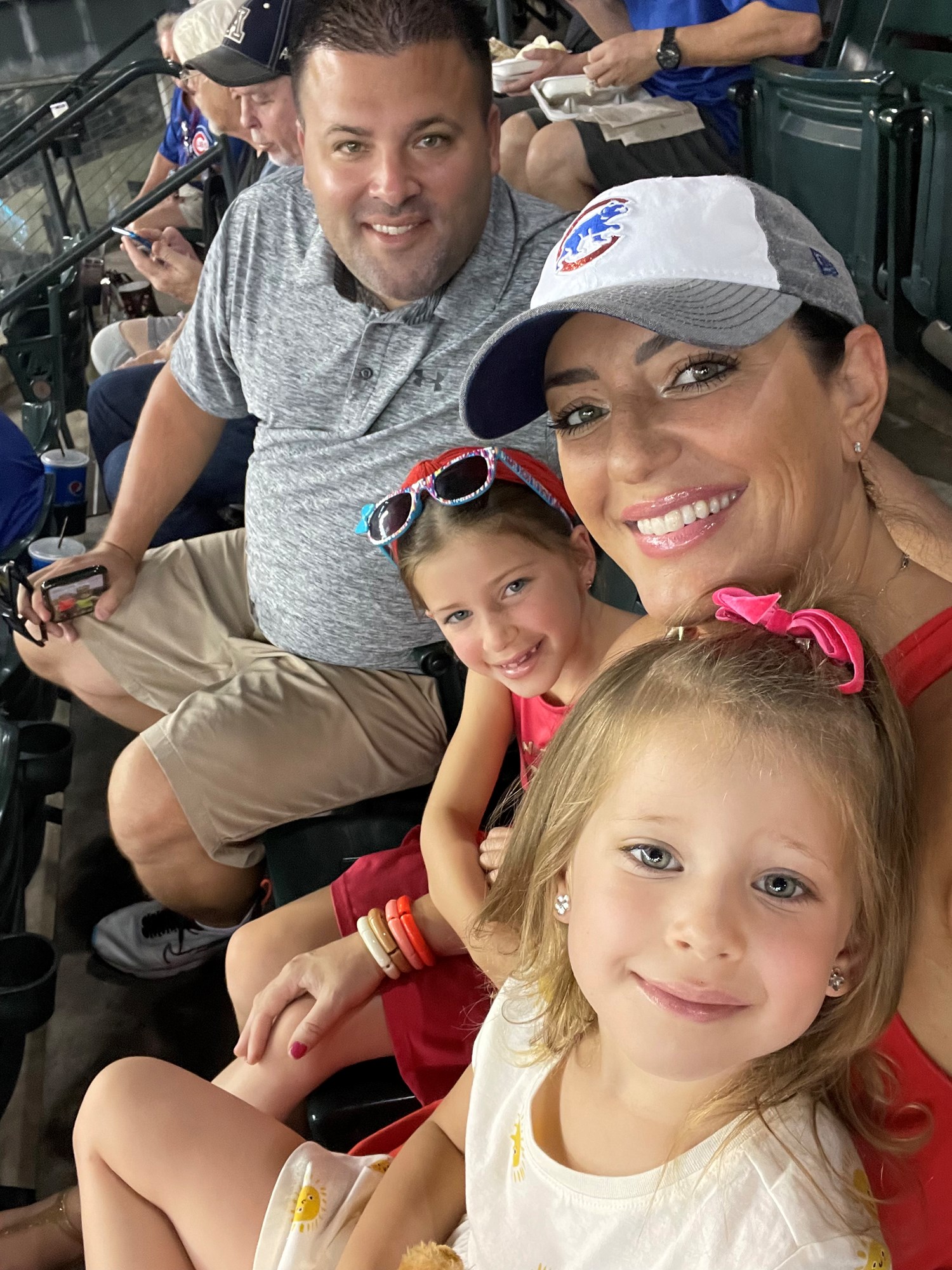 The Lehe family cheering on their Chicago Cubs. L to R: Adam, Adriana, Gina and Natalia.